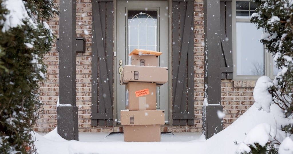 stack-of-packages-on-front-porch