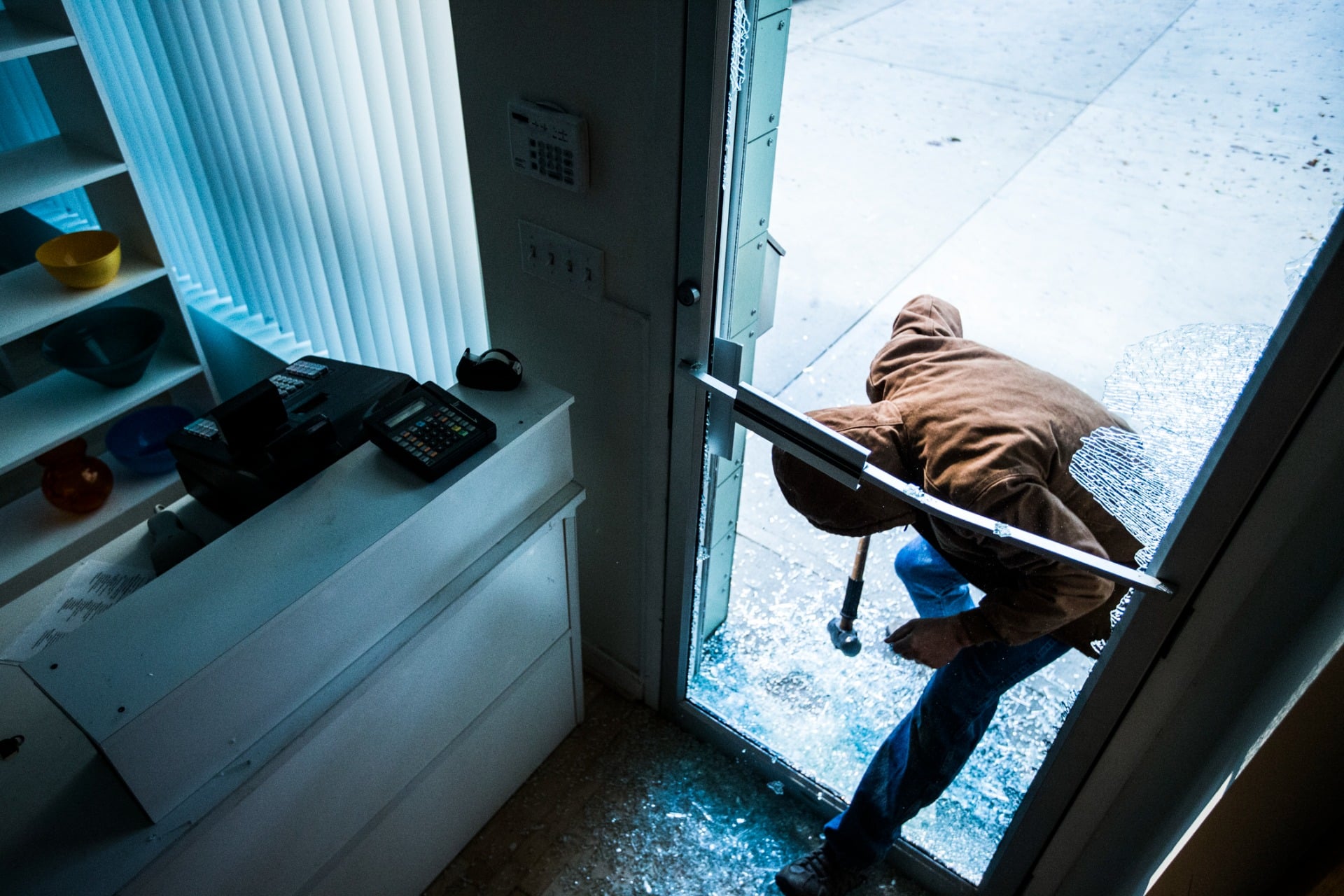 A burglar breaking into a business